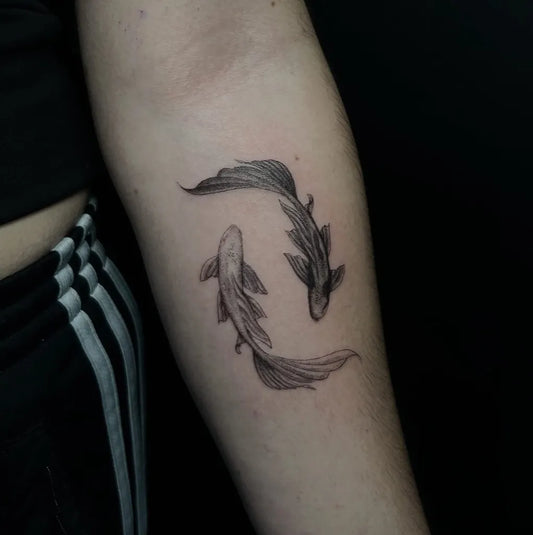 Small Black and Grey Yin Yang Koi Tattoo on Women Arm by @toms.tatts