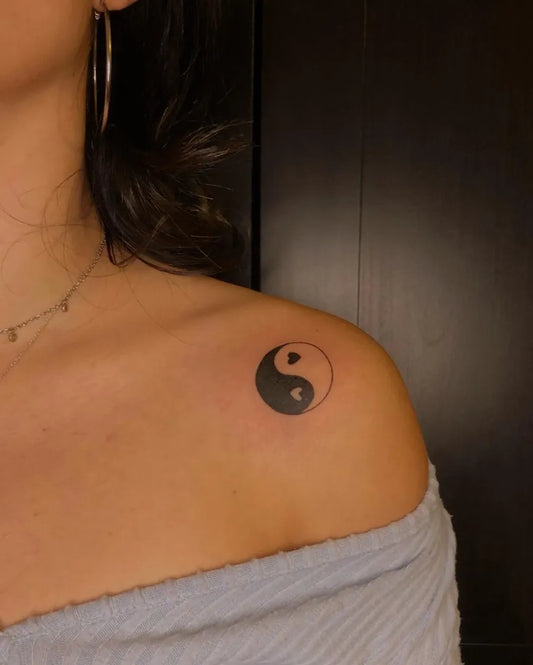 Small Black and Grey Yin Yang Tattoo on Women Shoulder by @poppytattooo