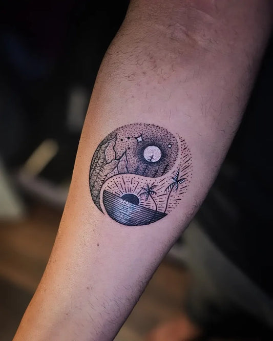 Small Black and Grey Yin Yang with Palm Trees Tattoo on Women Arm by @inkredible_tattoos_nagpur