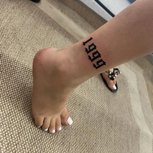 Small Blackwork 1999 Number Tattoo on Women Ankle by @inkbycrow