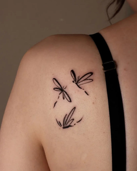 Small Blackwork 3 Simple Dragonflies on Women Shoulder Tattoo by @suzies_ink