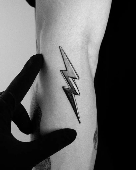 Small Blackwork 3D Lightning Tattoo on Men Arm by @guccidayoff