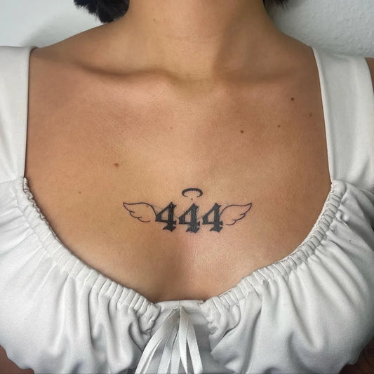 Small Blackwork 444 Angel Wings on Women Chest Tattoo by @laylizzle.tats