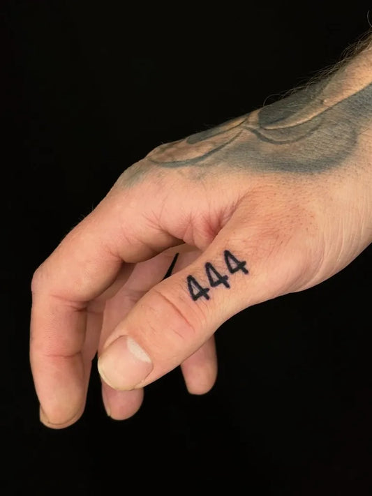 Small Blackwork 444 on Men Finger Tattoo by @mythicalmind.tattoos