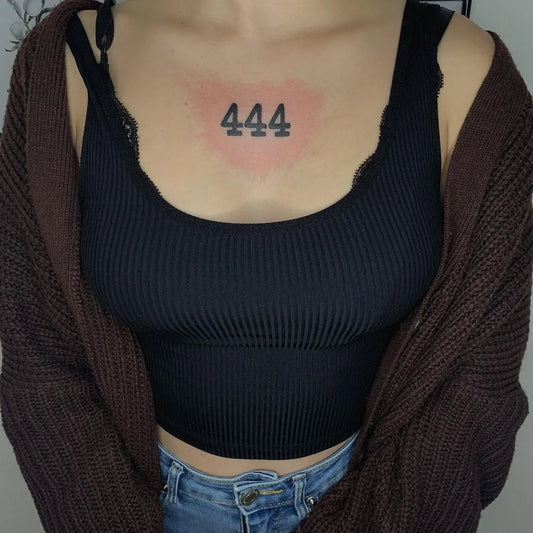 Small Blackwork 444 on Women Chest Tattoo by @_nemejstrach.z.jehel_