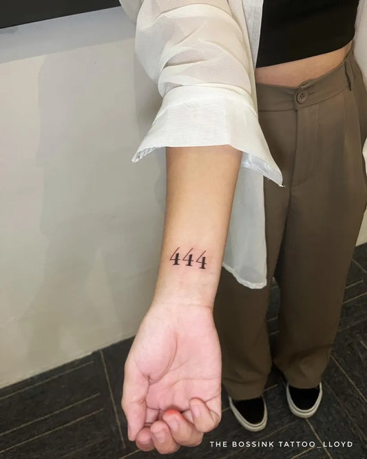 Small Blackwork 444 on Women Wrist Tattoo by @thebossink.tattoo