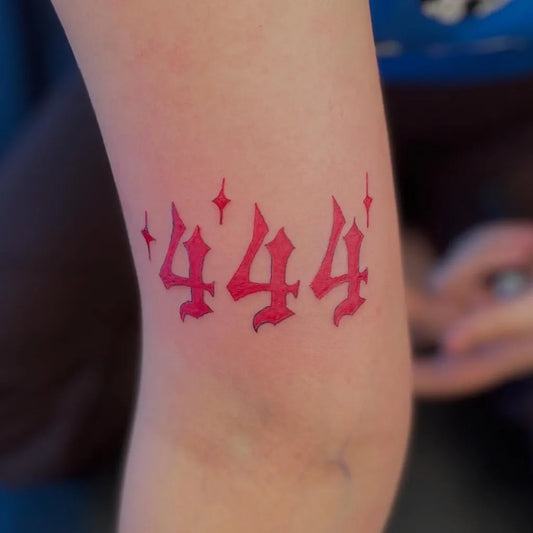 Small Blackwork 444 with stars on Women Knee Tattoo by @stripestattoos