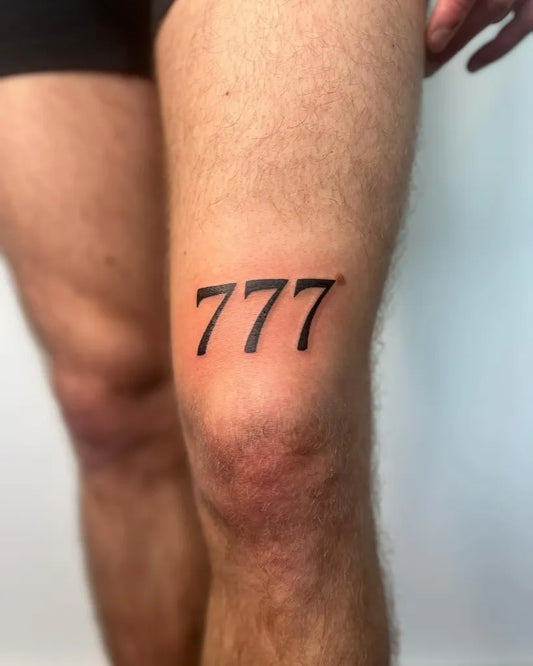 Small Blackwork 777 Tattoo on Men Knee by @vitality_tattoo