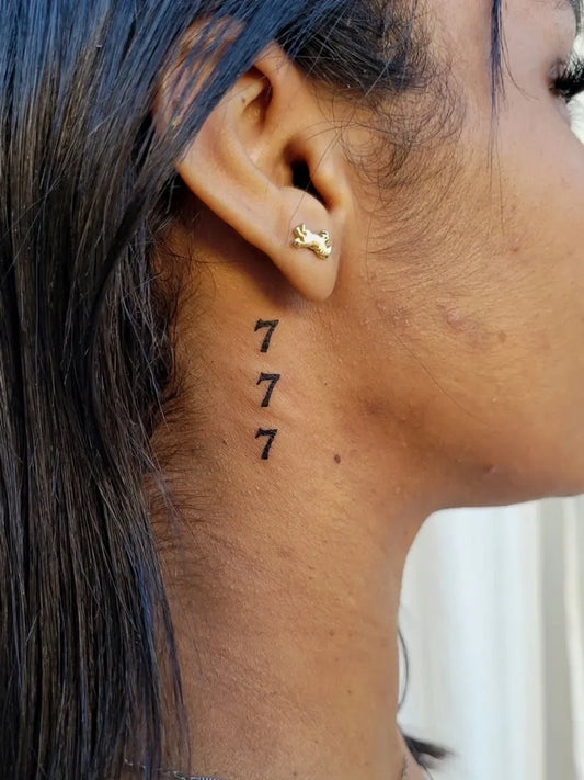 Small Blackwork 777 Tattoo on Women Neck by @milenasozi