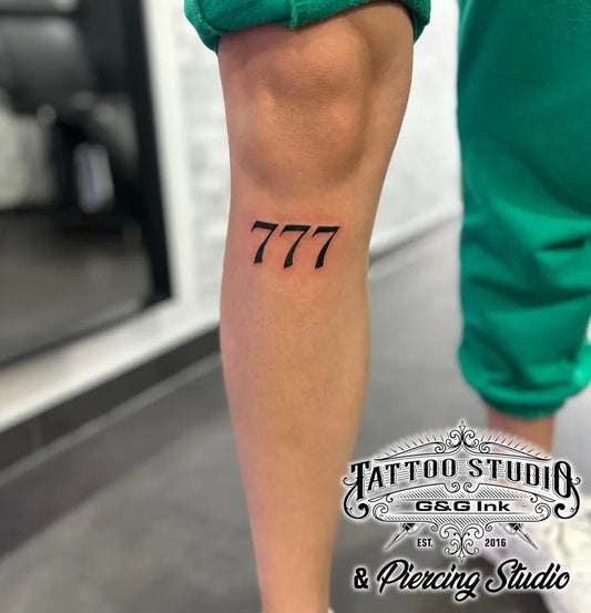 Small Blackwork 777 Tattoo on Women Thigh by @g.g.ink.tattoos
