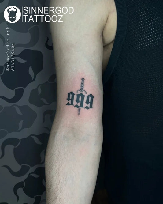 Small Blackwork 999 Dagger Tattoo on Men Arm by @sinnergodtattooz
