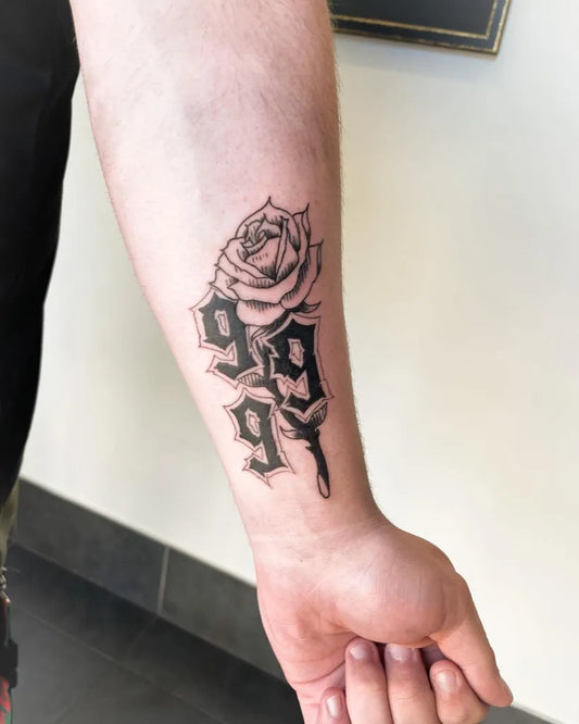 Small Blackwork 999 Rose Tattoo on Men Arm by @breezenugg_tattoo