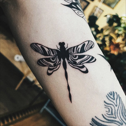 Small Blackwork Abstract Dragonfly on Women Arm Tattoo by @murikaz