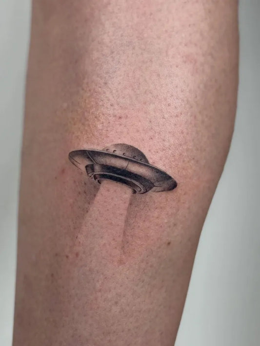 Small Blackwork Alien UFO Tattoo on Women Thigh by @josuealienigena