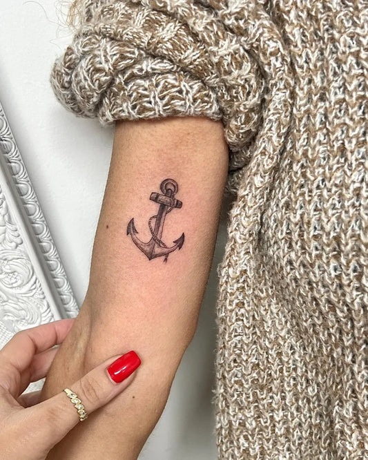 Small Blackwork Anchor Tattoo on Women Upper Arm by @lirontal_tattoo_piercing_