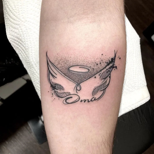 Small Blackwork Angel Wings Oma Tattoo on Men Forearm by @jellyfish.tattoo.art