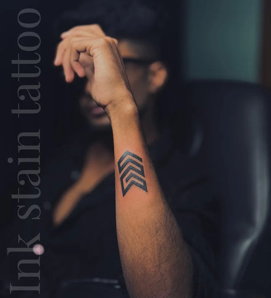 Small Blackwork Arrow Tattoo on Men Forearm by @ink_stain__tattoostudio