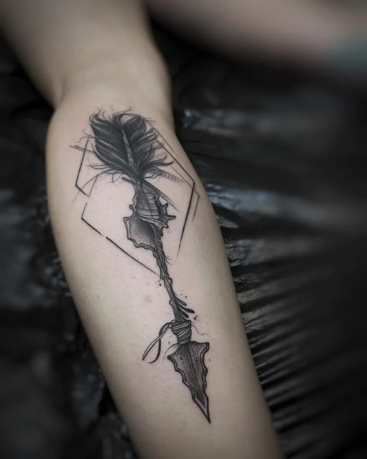 Small Blackwork Arrow Tattoo on Women Leg by @j.art_tattoo
