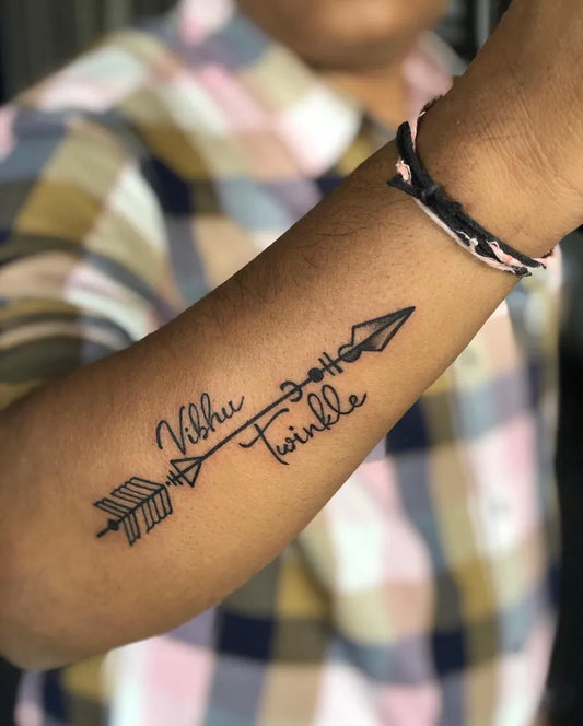Small Blackwork Arrow and Script Tattoo on Men Arm by @artline_artist_tattoo