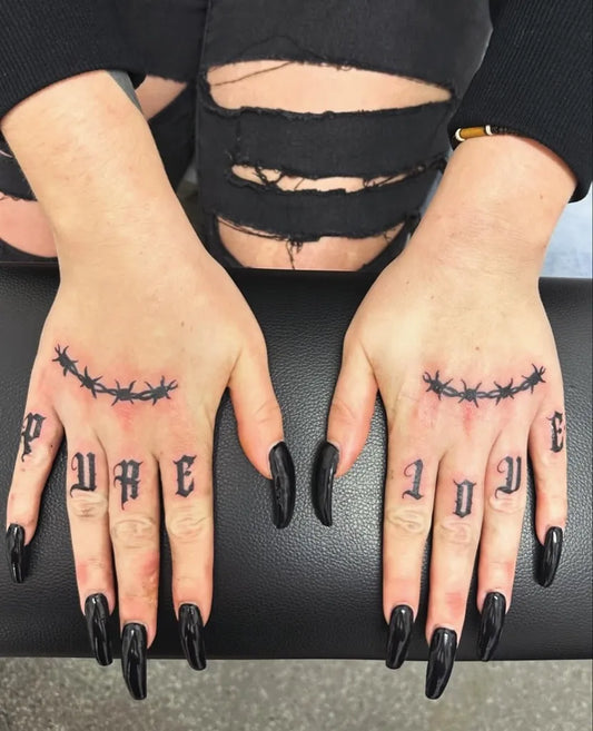 Small Blackwork BarbedWireAndPurseOnWomenFingers Tattoo by @tattoo_territory_darwin