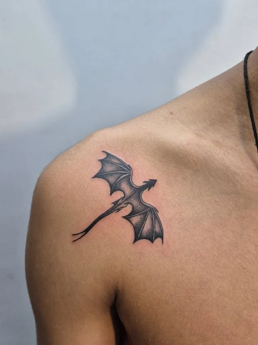 Small Blackwork Bat Tattoo on Men Shoulder by @vinktime_tattoo