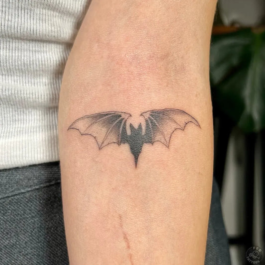 Small Blackwork Bat Tattoo on Women Forearm by @felatdelibalta