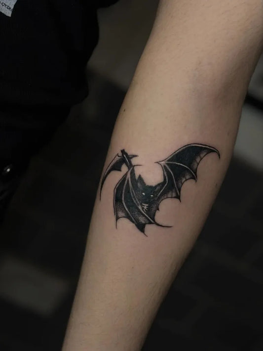 Small Blackwork Bat and Scythe Tattoo on Women Arm by @kruelwulf
