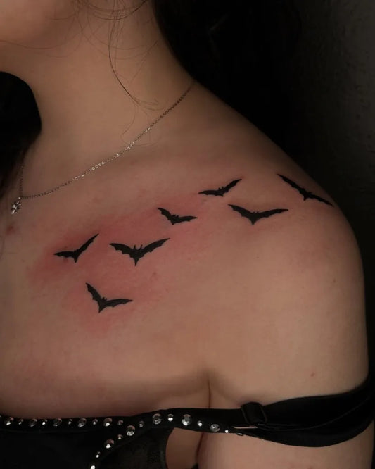 Small Blackwork Bats Tattoo on Women Collarbone by @tapiotats