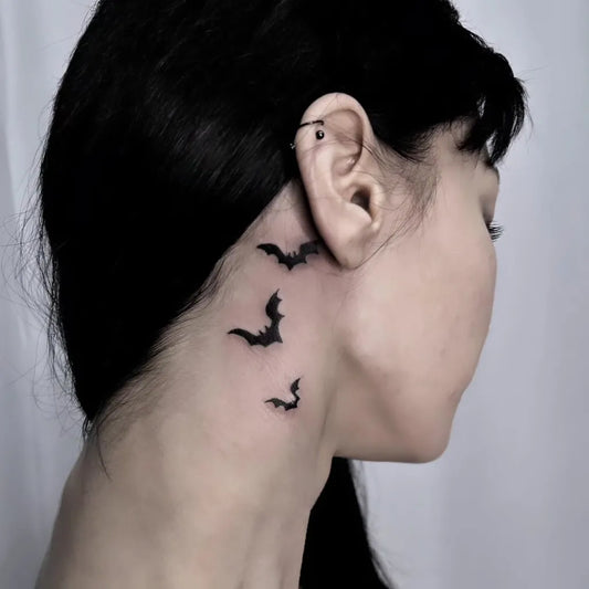Small Blackwork Bats Tattoo on Women Neck by @dublinpins