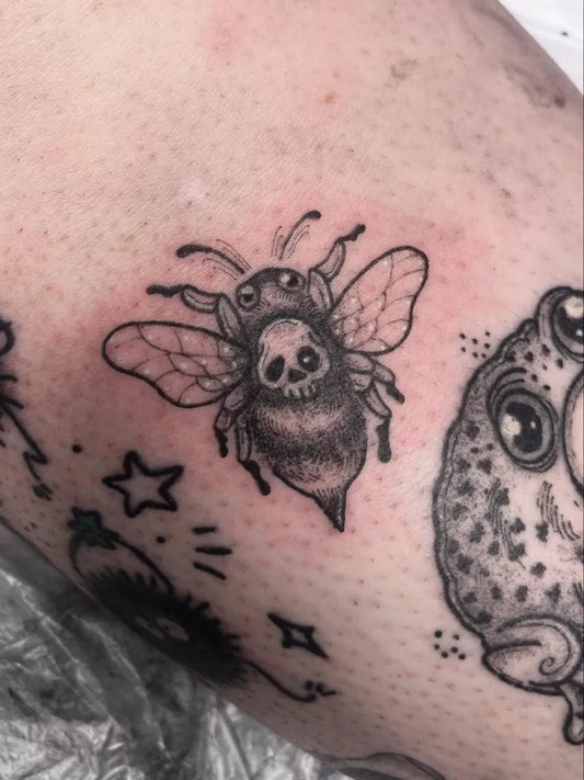 Small Blackwork Bee Skull on Women Arm Tattoo by @heymichaela