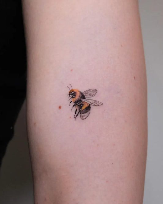 Small Blackwork Bee on Women Arm Tattoo by @achilletattoos