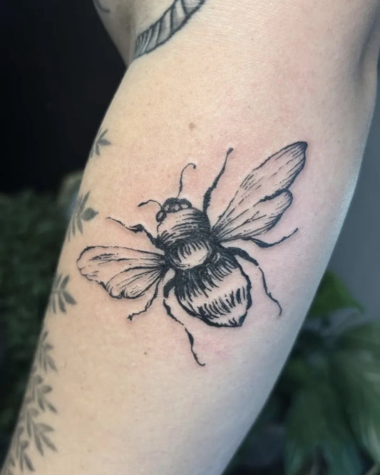 Small Blackwork Bee on Women Arm Tattoo by @alteredegotattoos