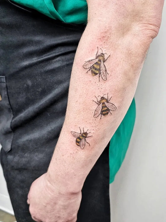 Small Blackwork Bee on Women Arm Tattoo by @leeink_studio