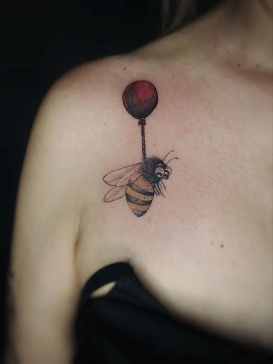 Small Blackwork Bee with Red Balloon on Women Shoulder Tattoo by @pardonmaman