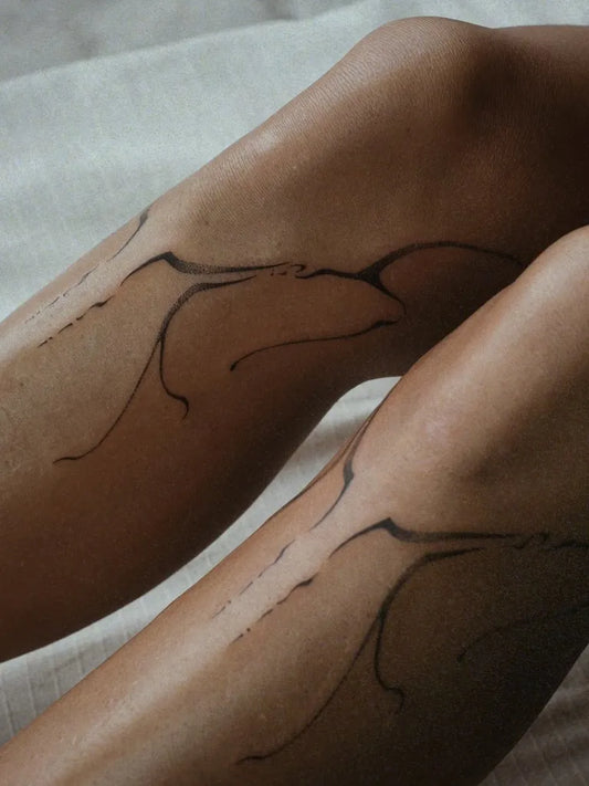 Small Blackwork Bird Tattoo on Women Knee by @mariepavlik