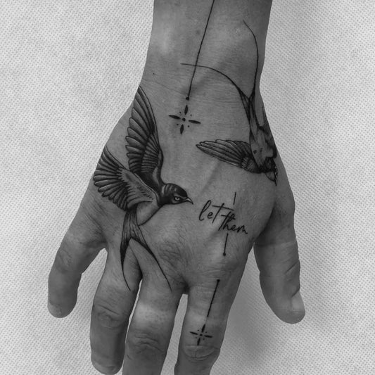Small Blackwork Birds Tattoo on Men Hand by @reni.tattoo_