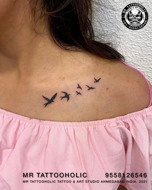 Small Blackwork Birds Tattoo on Women Collarbone by @mr_tattooholic_ahmedabad
