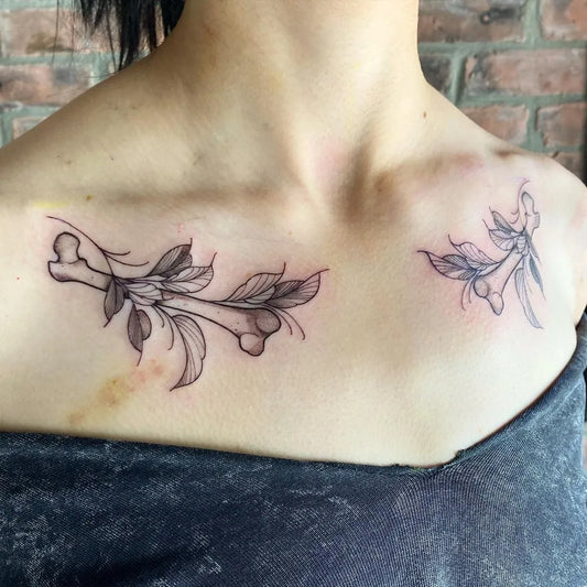 Small Blackwork Bones and Leaves Tattoo on Women Collarbone by @inkbymartha