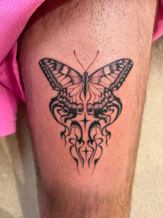 Small Blackwork Butterfly on Men Thigh Tattoo by @softfury