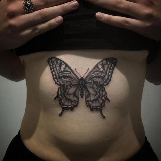 Small Blackwork Butterfly on Women Sternum Tattoo by @megtattoo