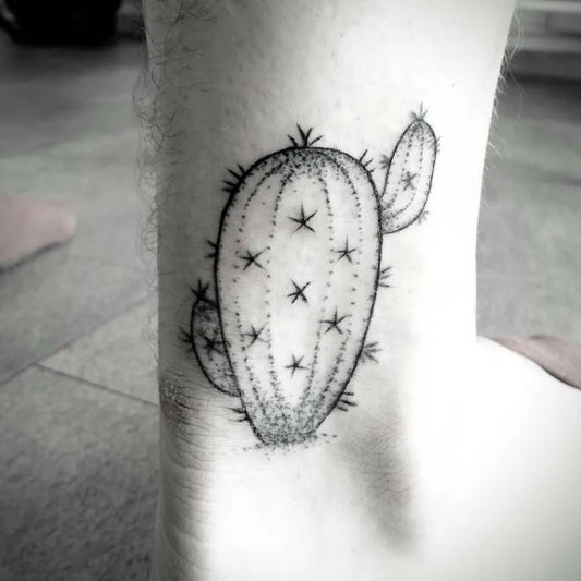 Small Blackwork Cactus Tattoo on Men Ankle by @indigenoustattoo