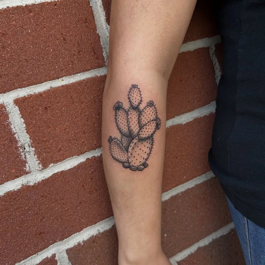 Small Blackwork Cactus Tattoo on Women Arm by @tats_by_morg