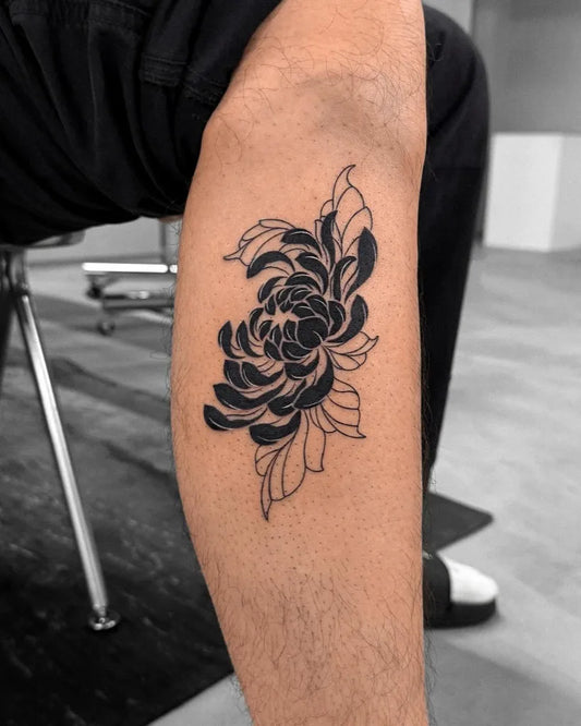 Small Blackwork Chrysanthemum Tattoo on Men Leg by @offtattooer