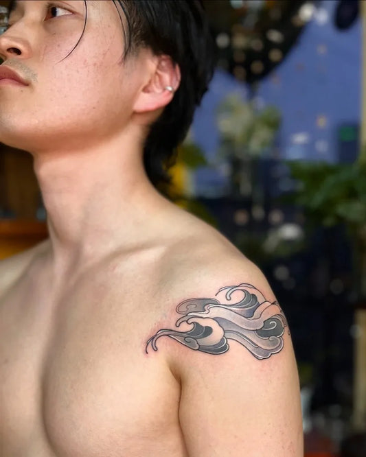 Small Blackwork Cloud Tattoo on Men Shoulder by @naryn.wave