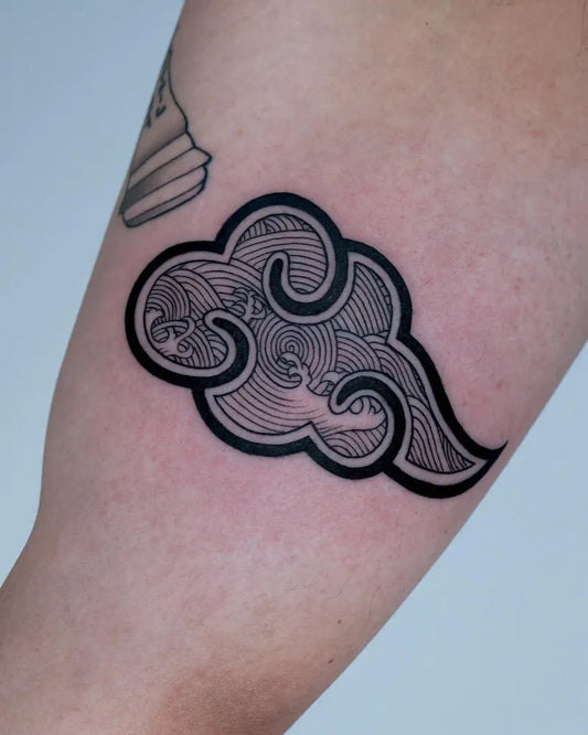 Small Blackwork Cloud Tattoo on Women Arm by @saki.lss