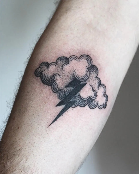 Small Blackwork Cloud and Lightning Tattoo on Men Arm by @rachel__finelli