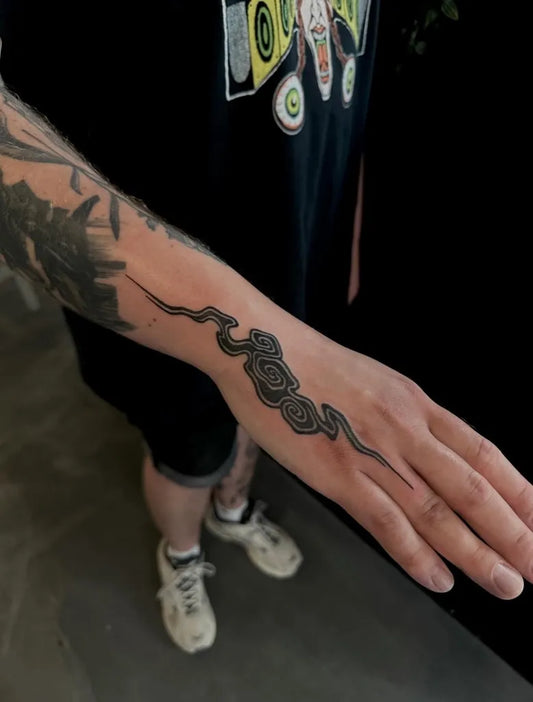 Small Blackwork Cloud and Snake Tattoo on Men Wrist by @chikage8