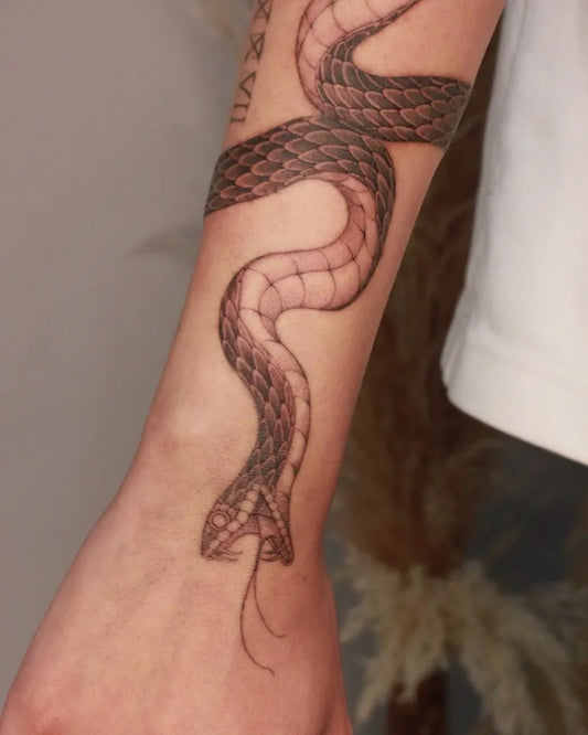 Small Blackwork Coiled Snake on Men Forearm Tattoo by @inkedbyv