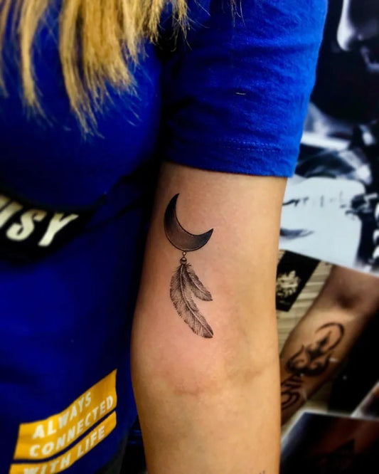 Small Blackwork Crescent Moon and Dream Catcher Tattoo on Women Arm by @body_art_tattooz