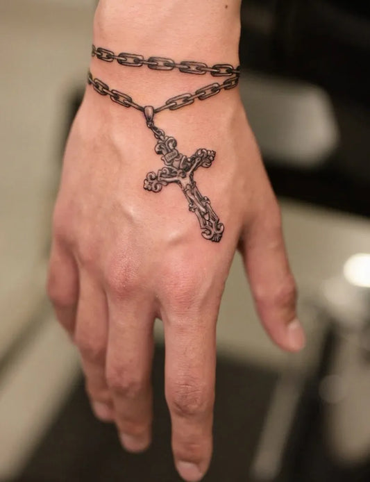Small Blackwork Cross Rosary Chain on Men Wrist Tattoo by @joey_tattooverse